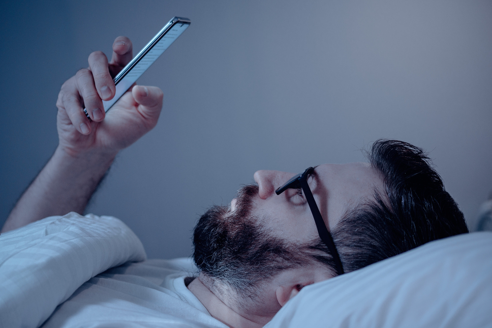 man looking at phone